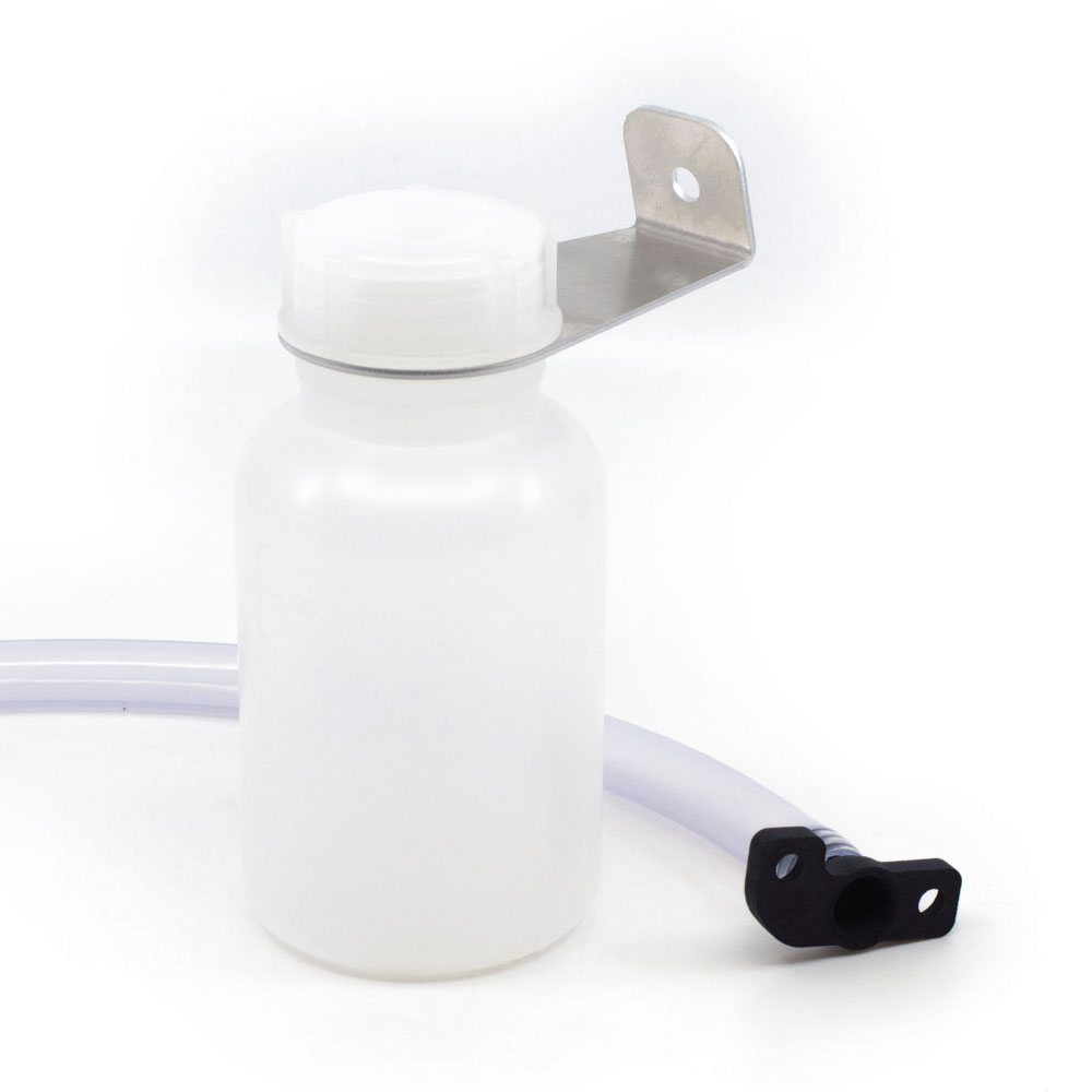 The ARMANOV Spent Primer Chute for Dillon XL650/750 ensures a clean workspace by routing spent primers through a transparent tube into a secure bottle.