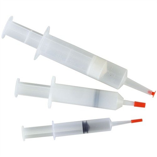 The Brownells Re-Usable Syringe Try-Pack includes three sizes for precise dispensing of Acraglas~, wood glues, and greases, ensuring accuracy and convenience.