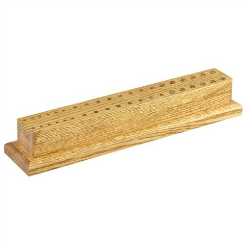 The Brownells Gunsmith's Punch & Needle File Block organizes your workspace with multiple hole sizes, reducing clutter and keeping tools easily accessible.