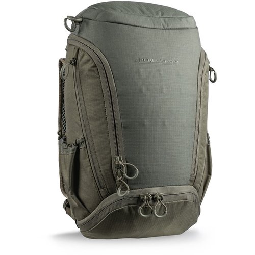 The Eberlestock Little Trick Pack offers 1,140 cubic inches of flexible storage for firearms and gear, featuring a zip-away cover, rare-earth magnets, and MOLLE-10 webbing.