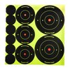 SHOOT-N-C® targets make hits visible with fluorescent halos, featuring peel-n-stick adhesive, multiple bullseye sizes, and reflective options for laser sights.