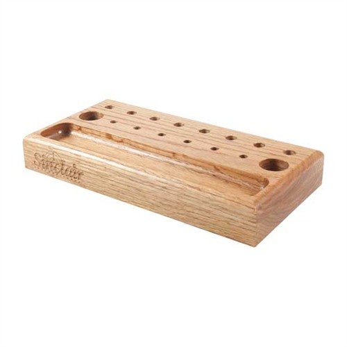 Organise your workspace with the Sinclair International Bench Top Tool Holder, featuring 16 holes for easy access, a channel for small parts, and durable oak construction.